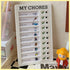 white chore checklist board with colorful good habits task icons